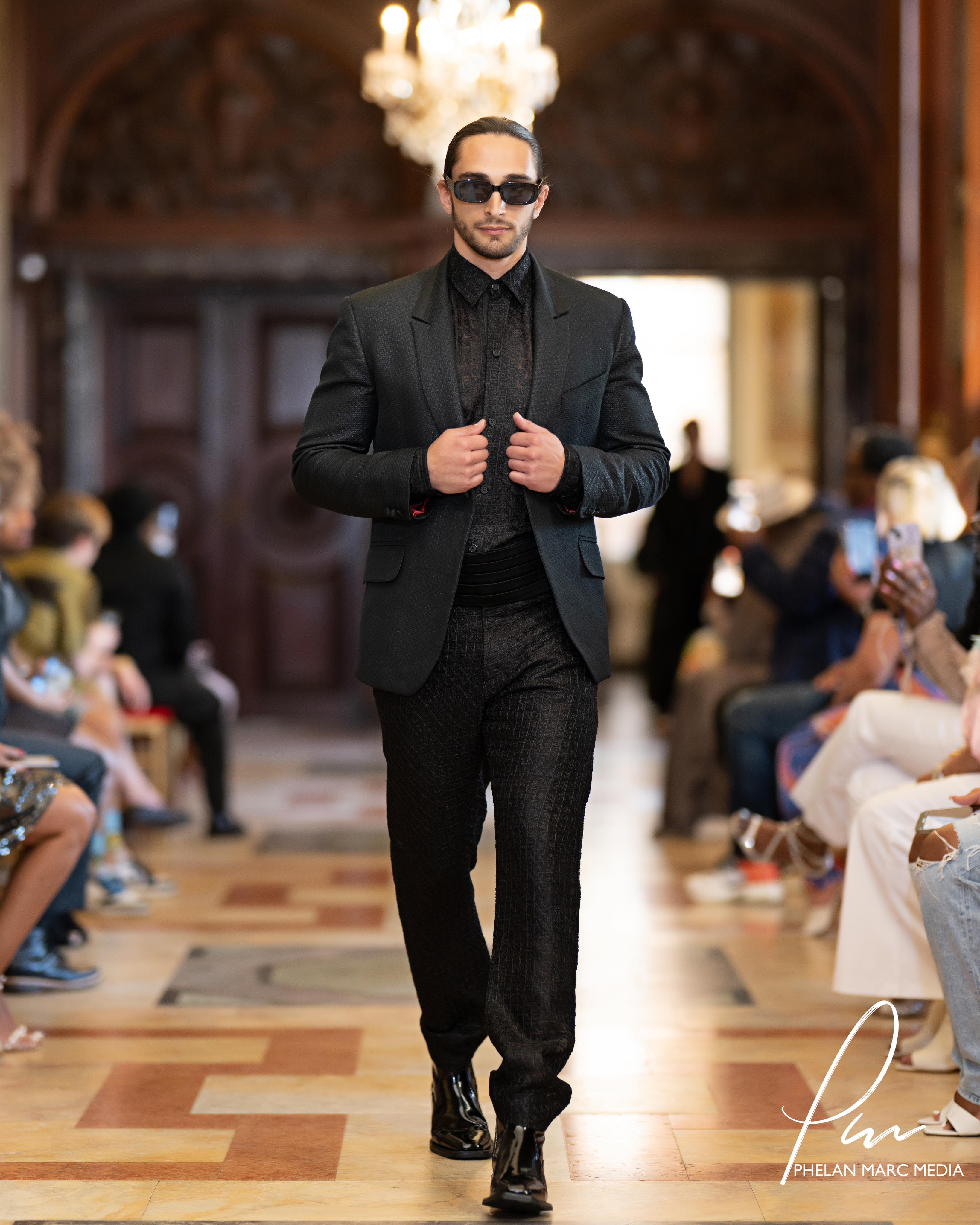 Runway picture in black Andrew Nowell custom-tailored suit.